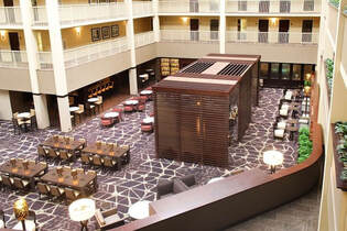 Inside the Embassy Suites atrium — breakfast and evening reception included